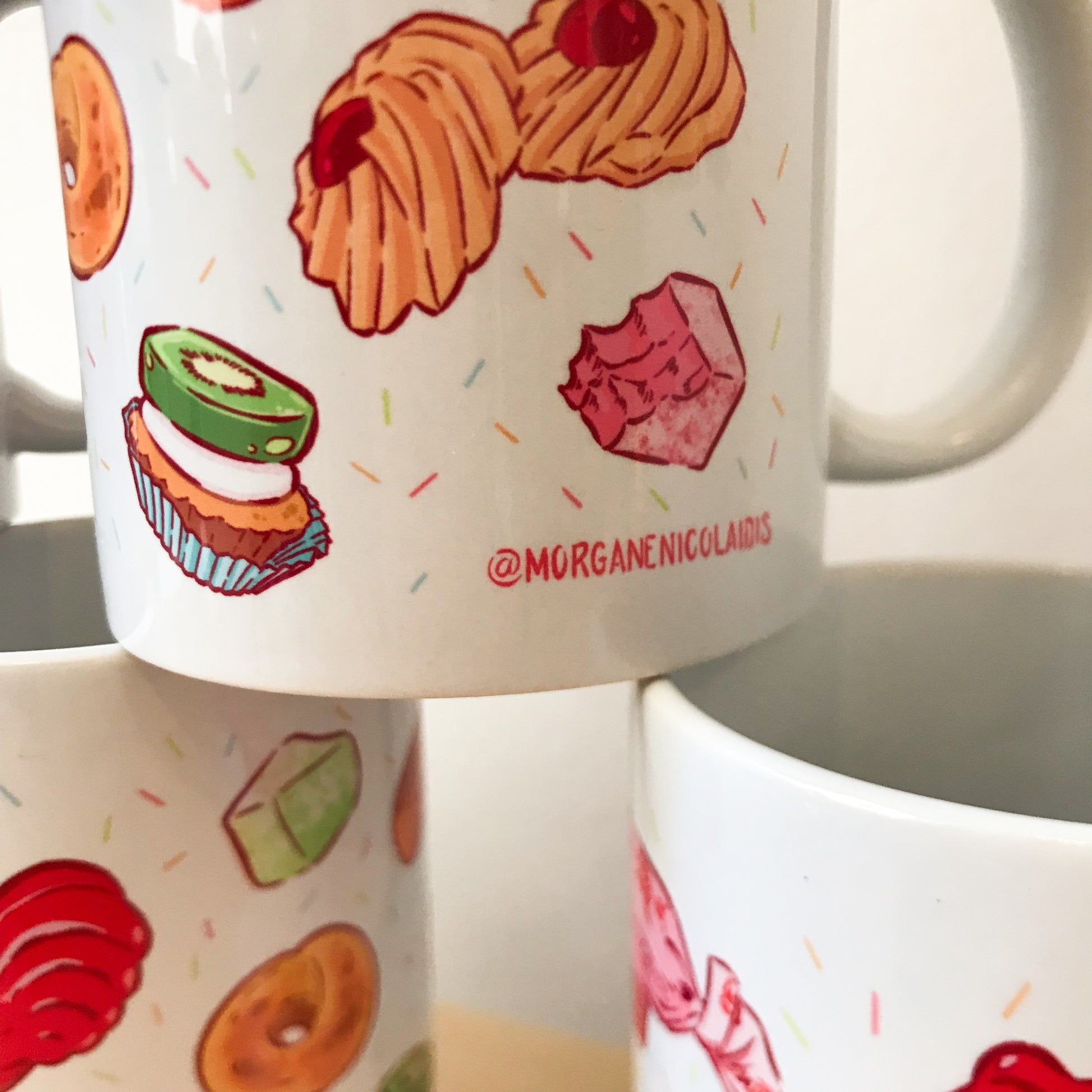 close up of some mugs - signature visible.